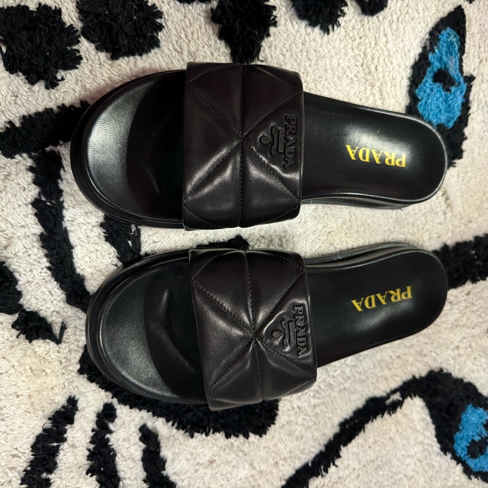 PRADA
Black Quilted Nappa Leather Pool Slide